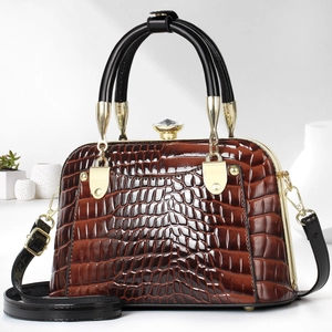 Brown crocodile embossed shell bag featuring a luxury crystal clasp and gold hardware