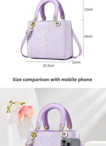 Detail of purple handbag with faux snakeskin texture, gold hardware, and size comparison