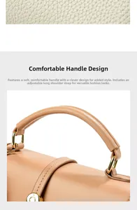 Detail des weichen Ledergriffs und des goldenen Metallschlosses der braunen Handtasche