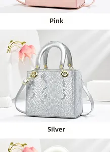 Detailed close-up of snakeskin texture bags in pink and silver with gold handles