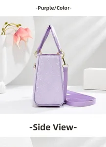 Side view of purple faux-leather handbag with snake skin texture and gold hardware