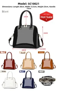 Detail view of glossy patent leather shell bag with dimensions 28x12.5x23cm and colors