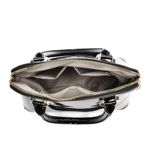 Internal view of shell bag with herringbone lining and multiple storage pockets