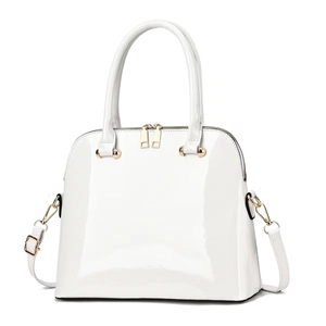 White glossy patent leather shell handbag with gold hardware and adjustable strap