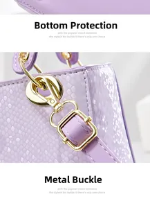 Detail of lavender embossed square bag featuring gold spring rings and lizard skin texture