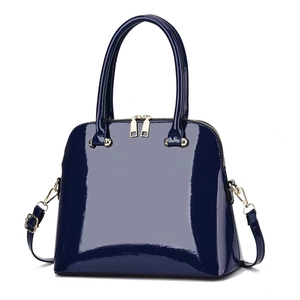 Navy blue patent leather shell bag with gold hardware and adjustable shoulder strap