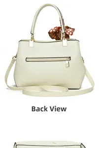 Back view of cream leather tote bag with zip pocket and polka dot silk scarf detail
