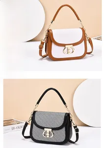 Detail of retro flap crossbody bags with unique double semi-circle metal locks and textures