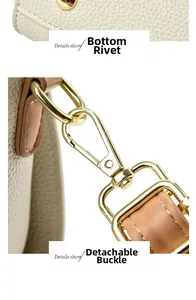 Detailaufnahme von Ledertasche mit goldenen Bodennägeln und abnehmbarem Metallhaken