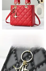 Detail of quilted leather handbag featuring a golden star charm and chain hardware