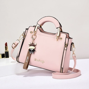 Pink fashion handbag for women with gold Dambooly logo and cute calf charm