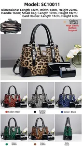 Detailed interior storage view of leopard print bucket bag with matching clutch and card case