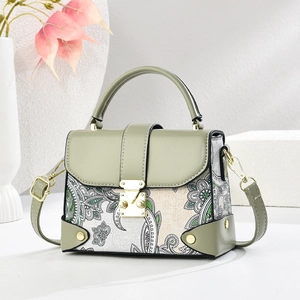 Women's paisley canvas crossbody handbag in sage green leather with golden lock