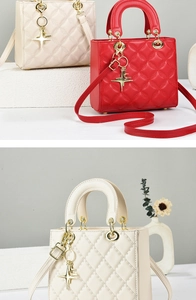 Detailed view of quilted faux leather handbag with gold star charm and detachable strap