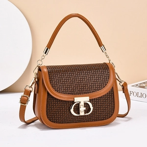 Brown leather crossbody bag with jacquard flap and gold buckle in 45-degree view