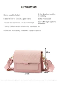 Pink crossbody bag dimensions 19x15x6cm with wide fabric strap and golden hardware detail