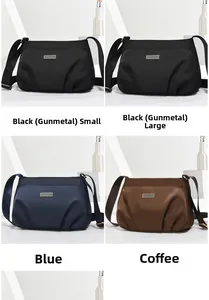 Nylon crossbody bags in black, blue, and brown with adjustable straps and logo detail