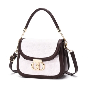 Chic brown and white checkered handbag with top handle and gold clasp closure