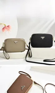 Detailed view of nylon mini crossbody phone bags in khaki, black and brown colors