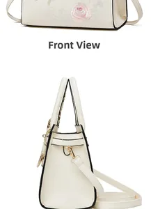 Detail of floral embroidery and gold hardware on beige Chinese style crossbody bag