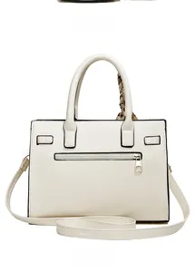 Rear view of beige handbag showing zipper pocket and silk scarf on top handle