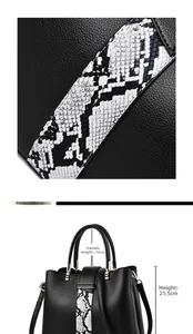 Detail view of black lychee grain leather bag with snake pattern and dimensions info