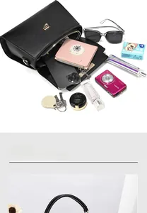 Internal view of the black pebbled leather crossbody bag showing spacious capacity