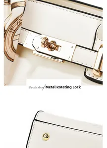 Detail of white textured leather handbag featuring a golden hardware twist lock and silk scarf