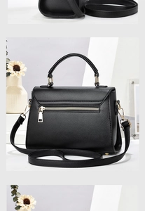 Detailed back view of black lychee texture bag featuring golden zipper pocket and metal hardware