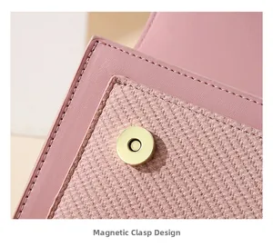 Detail of pink crossbody bag featuring magnetic snap closure and mixed fabric textures