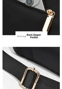 Detail of durable black nylon bag with gold metal zipper and back pocket