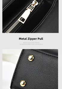 Detail of golden zipper and protective metal feet on black lychee leather handbag