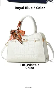 Detailansicht beige Handtasche mit Krokodilmuster, Goldschloss und Seidenschal