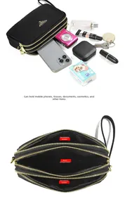 Three-layer zippered black nylon bag with space for smartphone and camera accessories