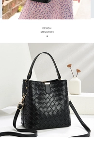 Close-up of black woven bucket bag showing intricate texture and gold hardware details