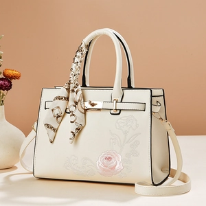 Elegant cream leather handbag with rose embroidery and silk scarf handle for women