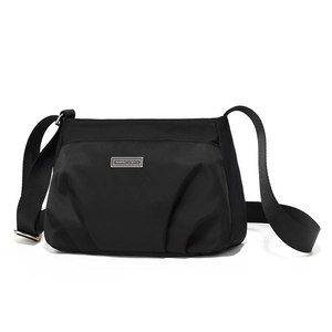Waterproof black nylon crossbody bag for women with adjustable strap and metal logo