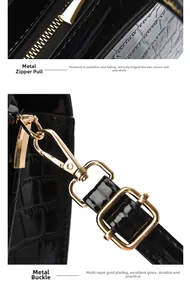 Detailansicht der glänzenden goldfarbenen Metallbeschläge und Krokostruktur auf Handtasche