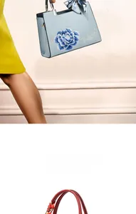 Détail de broderie florale sur sacs à main de mariage rouge et bleu avec foulard en soie