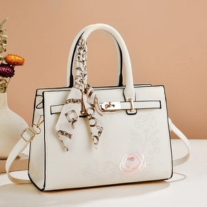 Elegant white PU leather handbag with rose embroidery and chain silk scarf detail