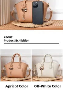 Close-up of pebble leather handbags in apricot and beige with bow tassel charms