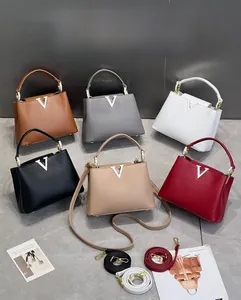 Detailansicht mit verschiedenen Farboptionen und Maßen der Kelly Handtasche