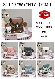Mini retro shoulder bag with plush doll charm and printed strap in multiple colors