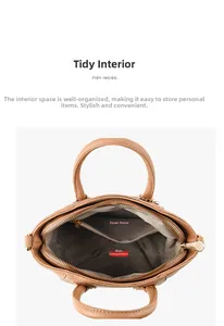 Internal structure of brown shell bag showing main zipper pocket and gray fabric lining