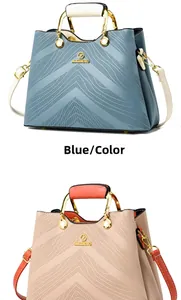 Close-up of elegant tote bags featuring textured wave patterns and metallic handles