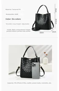 Detailed interior of black woven bucket bag showing large capacity and compartments