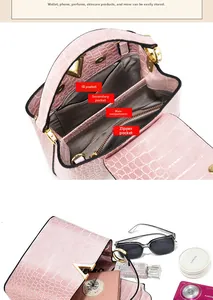 Detail of pink croc-embossed handbag showing internal compartments and golden V-lock
