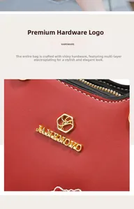Details goldener Beschläge und Jane Novo Logo auf einer luxuriösen roten Ledertasche