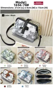 Detailed view of paisley print crossbody bag with triple zipper layers and 21x8x15cm dimensions