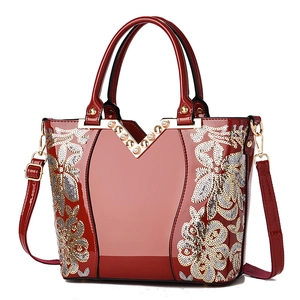 Elegante rote Lacklederhandtasche mit goldenen Pailletten und Nieten für Damen